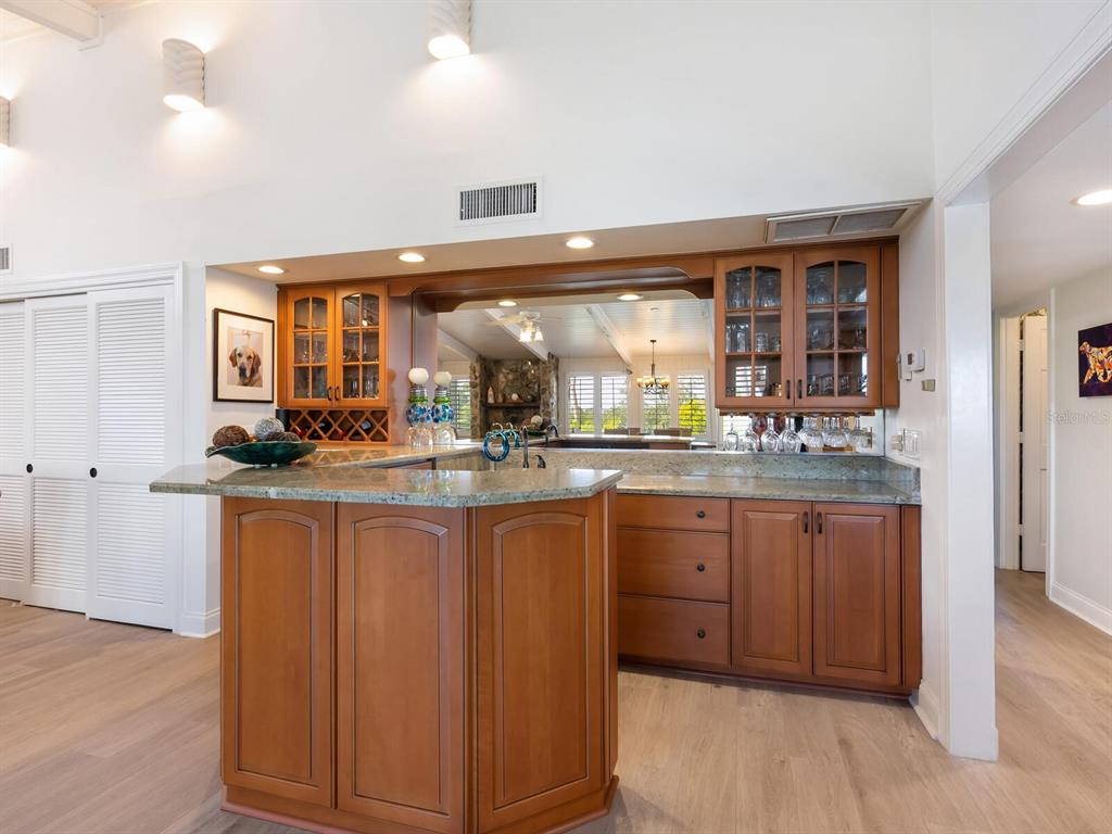 3240 Casey Key Road Nokomis, FL 34275 - Photo 14 of 51 a kitchen with granite countertop a sink and cabinets