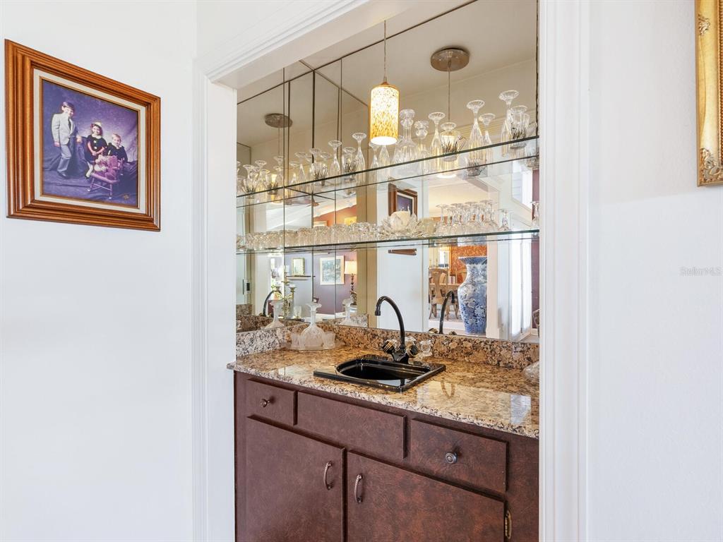3240 Casey Key Road Nokomis, FL 34275 - Photo 16 of 51 a kitchen with a sink and cabinets