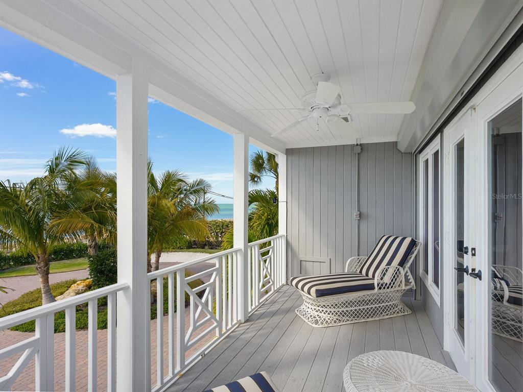 3240 Casey Key Road Nokomis, FL 34275 - Photo 20 of 51 a balcony with chairs and couch