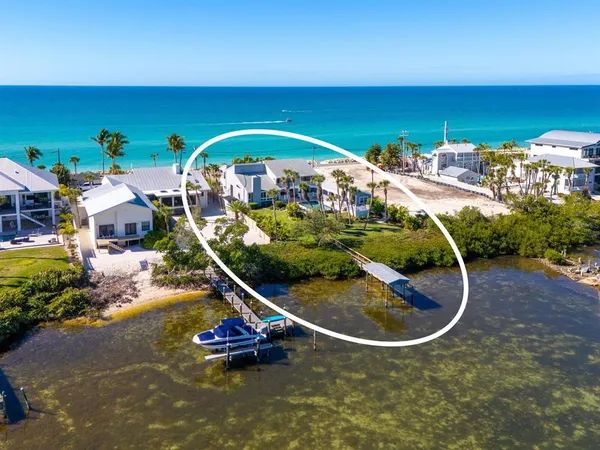 a view of a swimming pool with an outdoor space and seating area