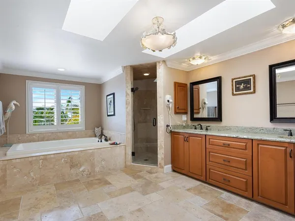 a bathroom with a tub and a window