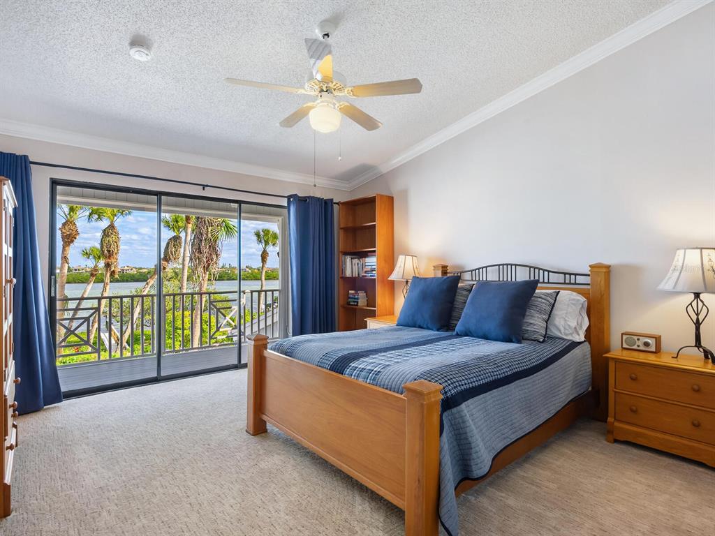 3240 Casey Key Road Nokomis, FL 34275 - Photo 24 of 51 a living room with a bed and a large window