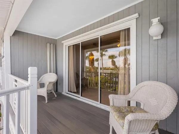 a view of a backyard with plants and lake view