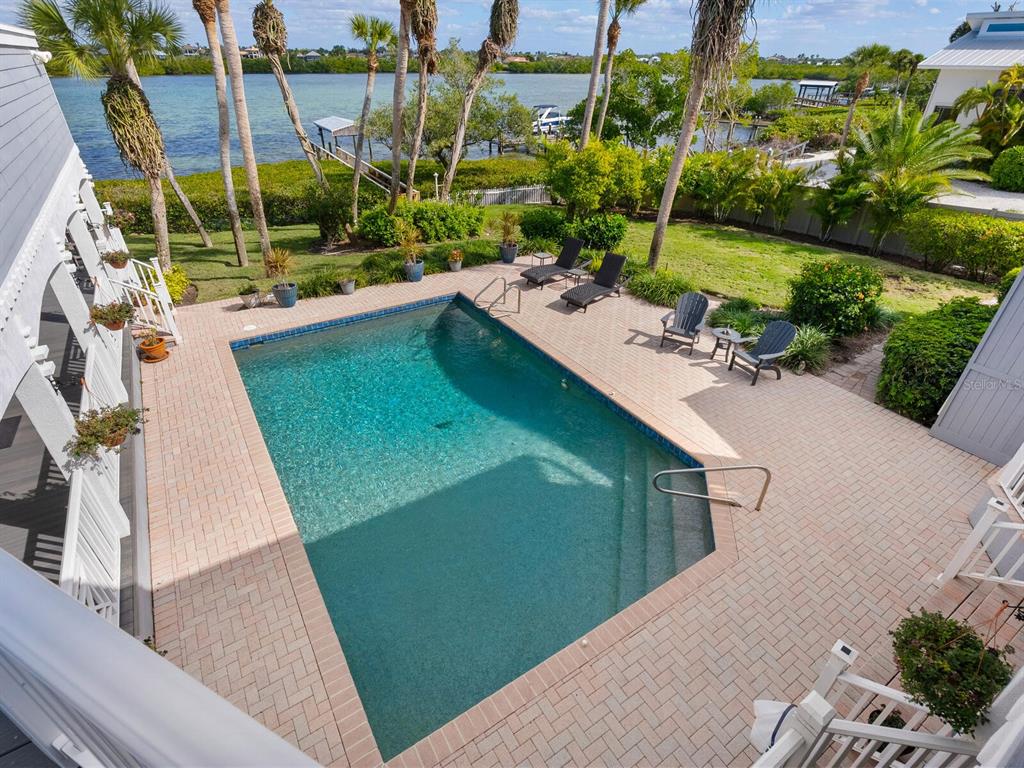 3240 Casey Key Road Nokomis, FL 34275 - Photo 29 of 51 a view of a backyard with plants and lake view