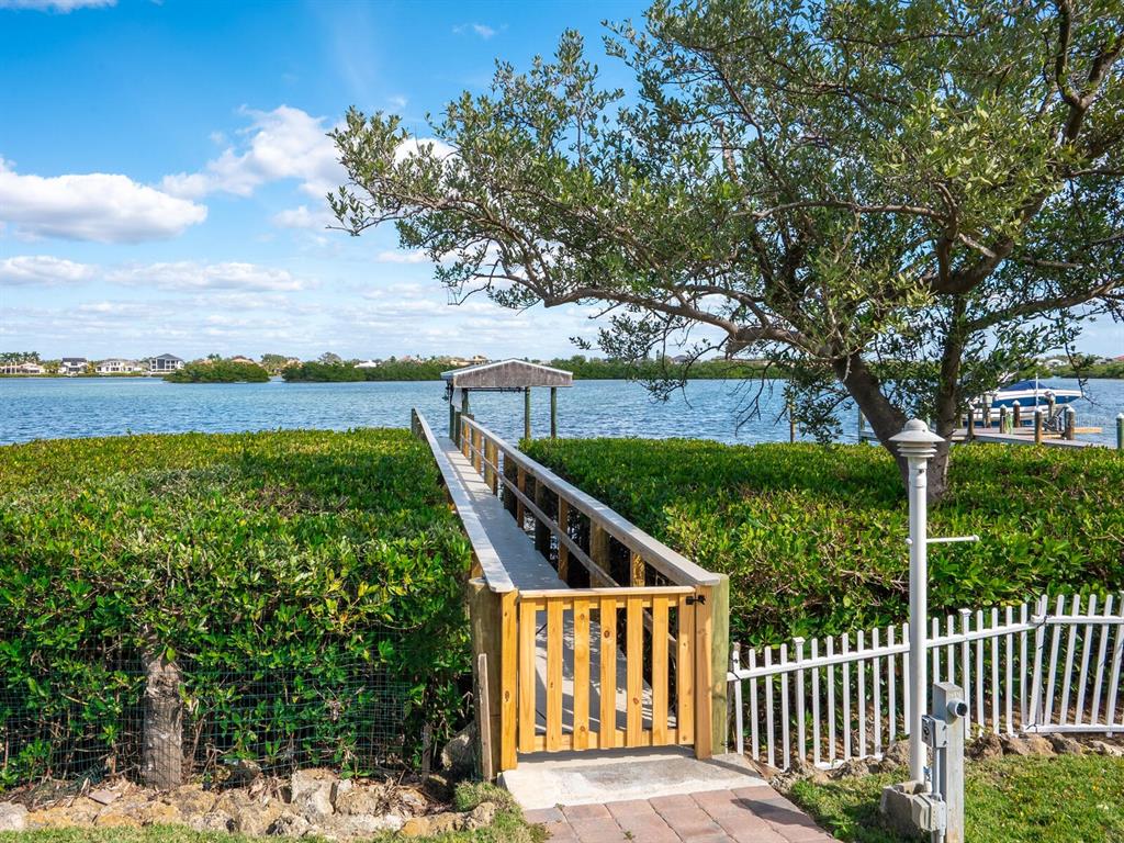 3240 Casey Key Road Nokomis, FL 34275 - Photo 35 of 51 a front view of a house with garden