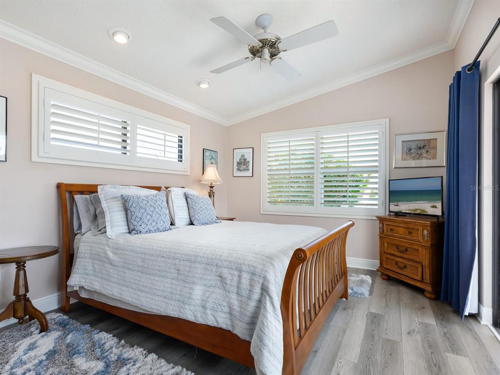 3240 Casey Key Road Nokomis, FL 34275 - Photo 39 of 51 a bedroom with a bed and a dresser