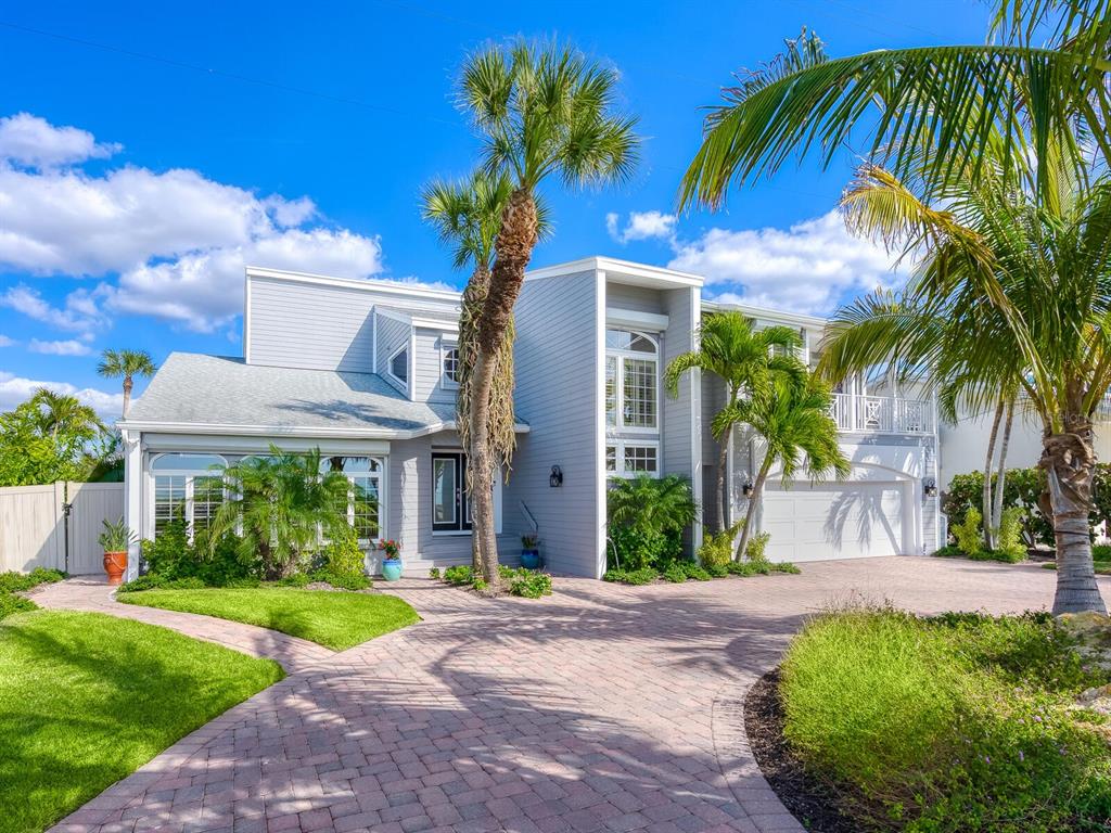 3240 Casey Key Road Nokomis, FL 34275 - Photo 4 of 51 a front view of house with yard and green space