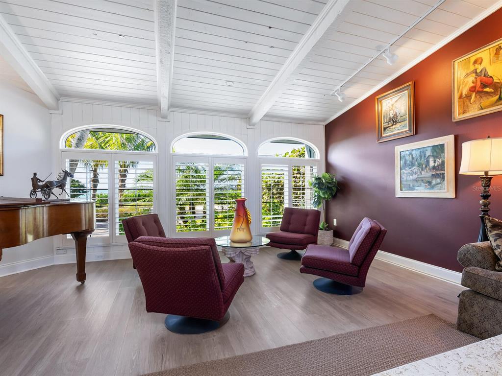 3240 Casey Key Road Nokomis, FL 34275 - Photo 6 of 51 a living room with furniture and a large window