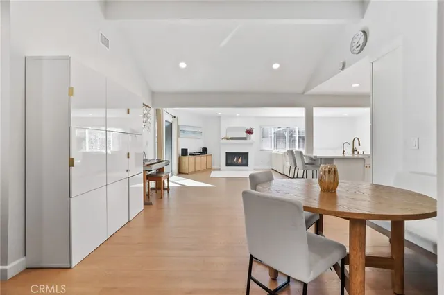 a living room with fireplace furniture and a wooden floor