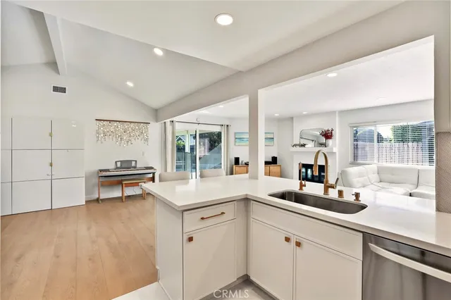 a kitchen with a stove a sink and a refrigerator