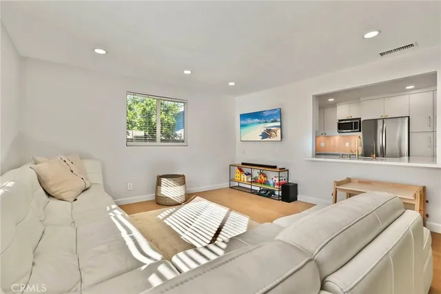 a view of a livingroom with furniture and window