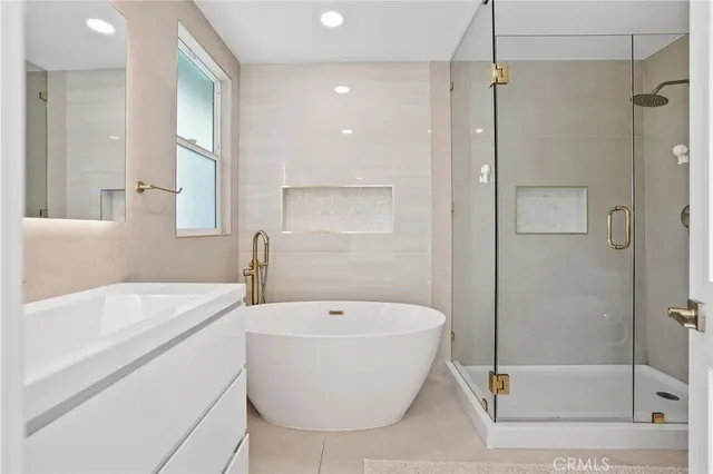 a bathroom with a bathtub and a sink