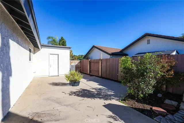 an aerial view of a house with swimming pool patio and outdoor seating