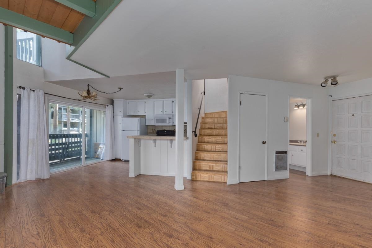 286 Old Mammoth Road, Unit 59 Mammoth Lakes, CA 93546 - Photo 1 of 31 a view of empty room with kitchen and window