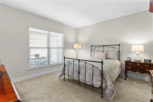 a bed room with a bed and a window