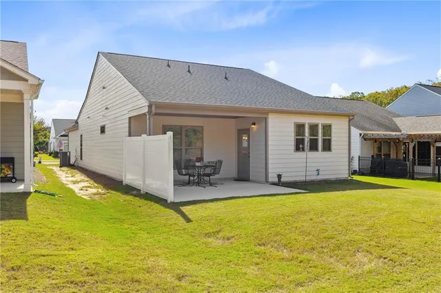 a view of a house with swimming pool and porch