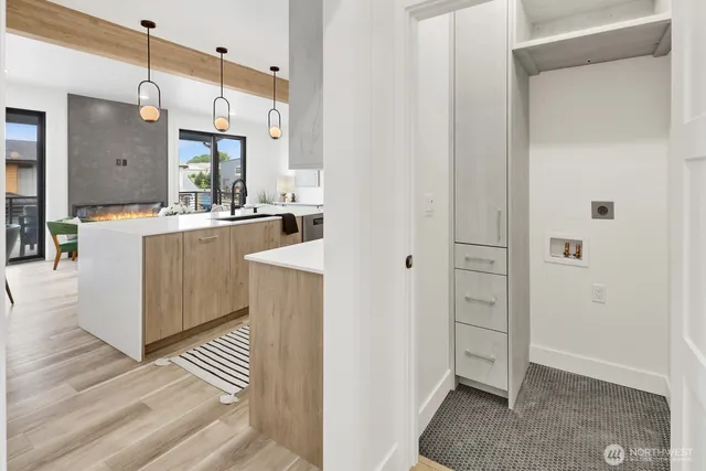 a view of kitchen with furniture and wooden floor
