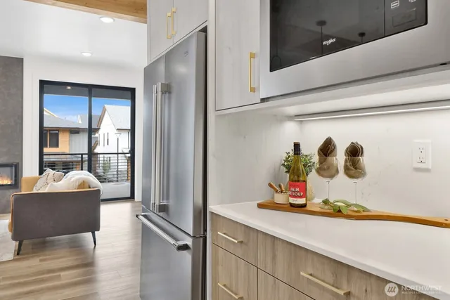 a kitchen with a sink and a refrigerator