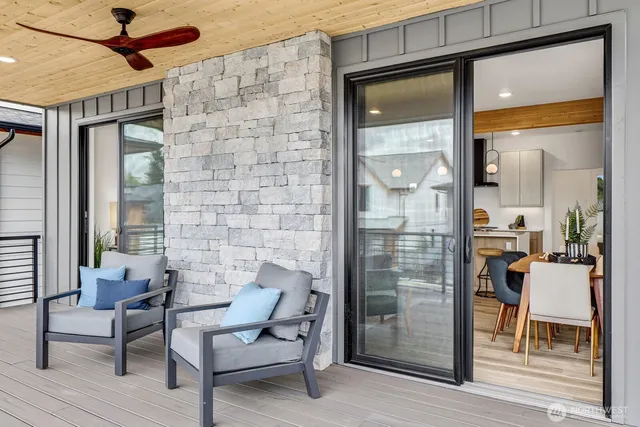 a living room with fireplace furniture and a wooden floor