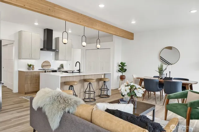 a living room with furniture rug and window