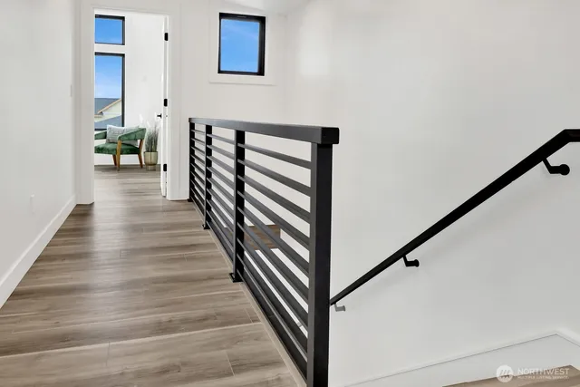 a bed room with a bed and a large window