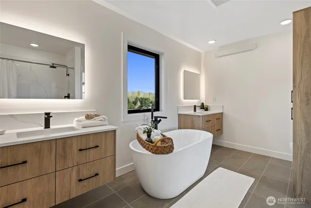 a bathroom with a granite countertop sink a toilet and mirror