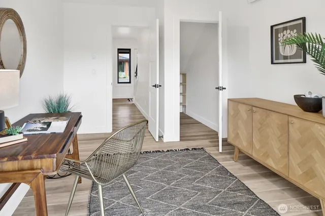 a en suite bathroom with a granite countertop sink and a mirror