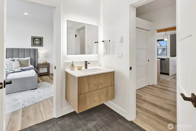 a bathroom with a sink a toilet and a shower