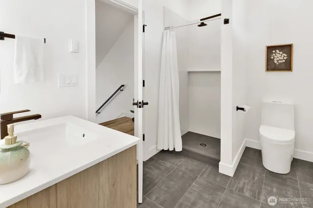 a bedroom with a bed and cabinets