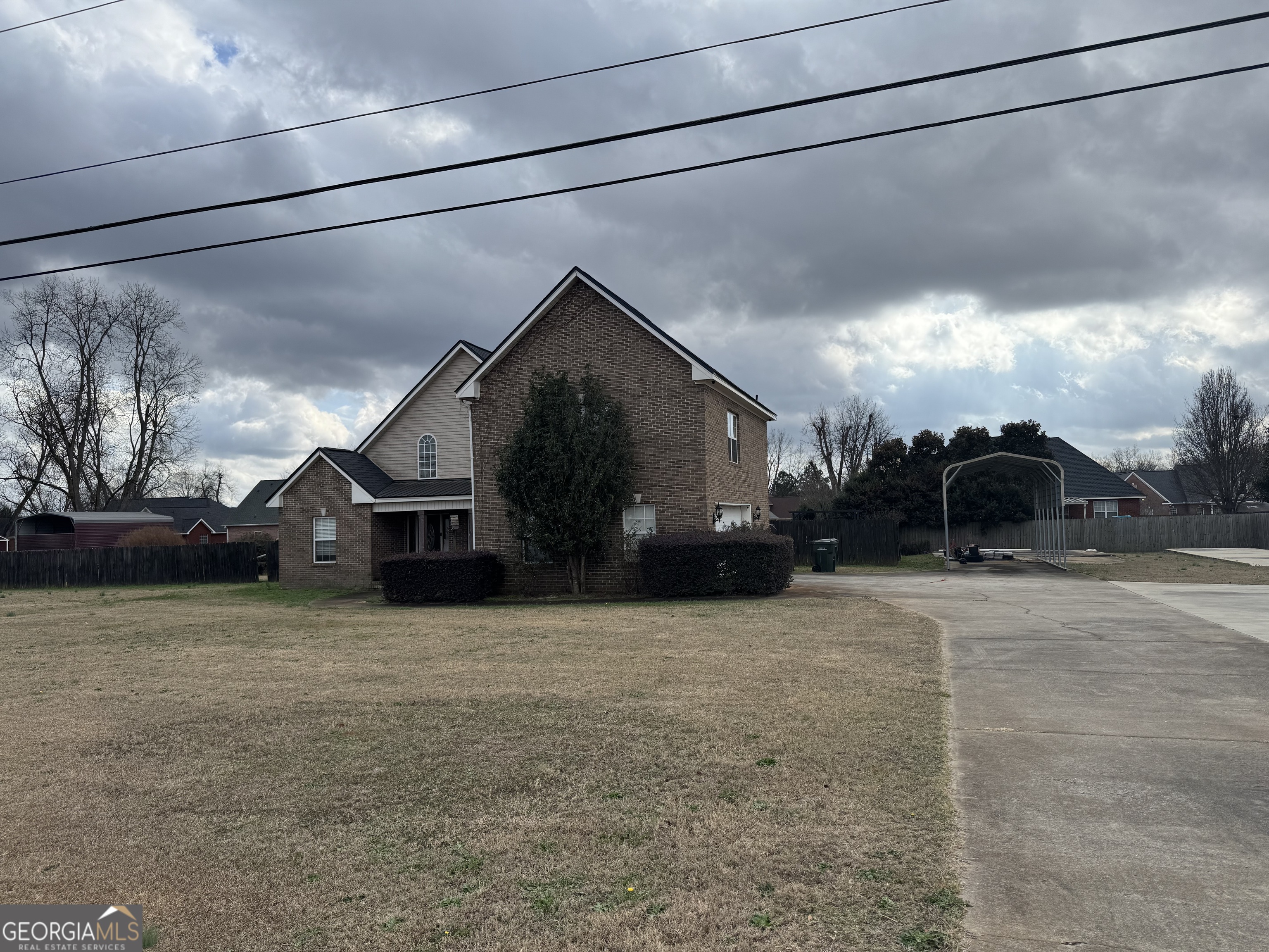2132 Kings Chapel Road Perry, GA 31069 - Photo 2 of 2 a view of a back yard of the house