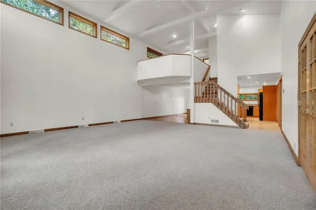 a view of a room with stairs and a window