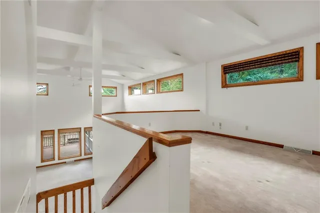 a view of a hallway with windows