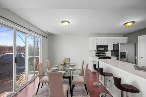 a view of a dining room with furniture window and outside view