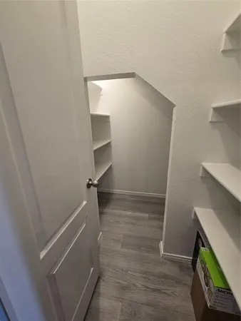 a view of an empty walk in closet
