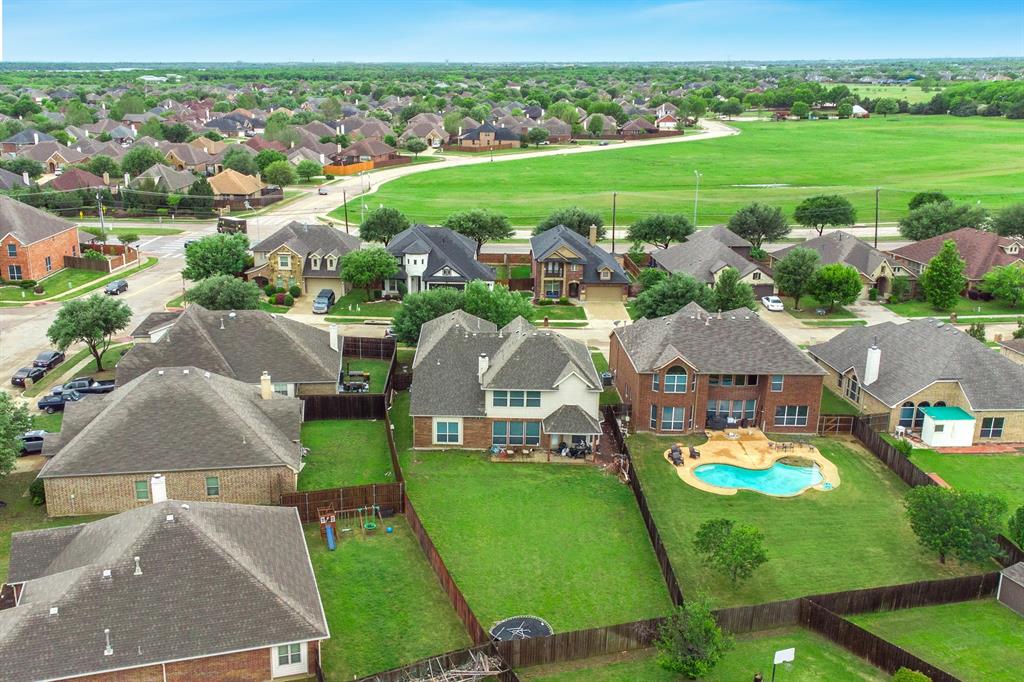 2312 Tawny Owl Road Grand Prairie, TX 75052 - Photo 39 of 40 Aerial perspective showcasing a residential area with diverse home styles