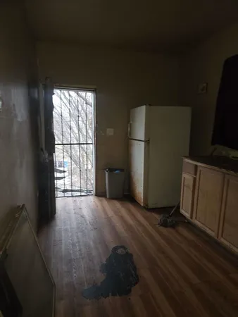 a view of an empty room with a window
