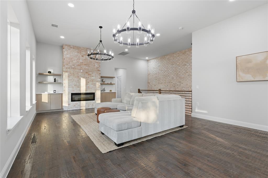 2150 Lakeview Mabank, TX 75156 - Photo 10 of 36 a living room with kitchen island furniture and a chandelier