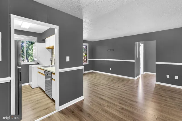 a view of a kitchen cabinets and wooden floor