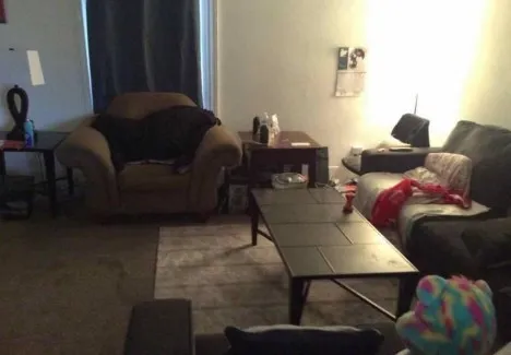 a bedroom with a bed and a mirror