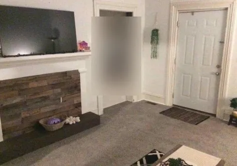 a spacious bedroom with a bed and a chandelier