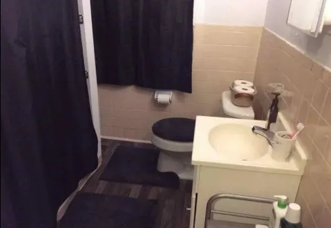 a kitchen with a refrigerator and a stove