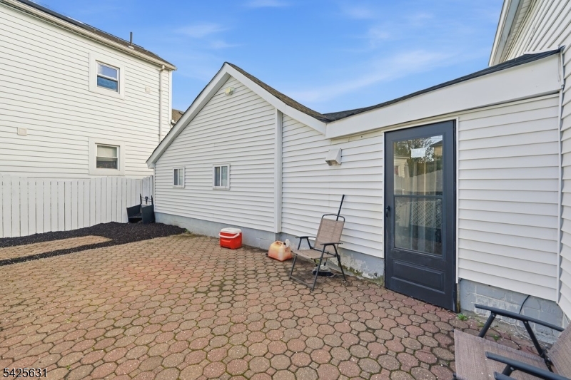60 Westervelt Place Lodi, NJ 07644 - Photo 37 of 48 a backyard of a house with wooden fence