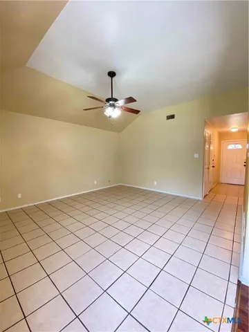 a view of an empty room and window