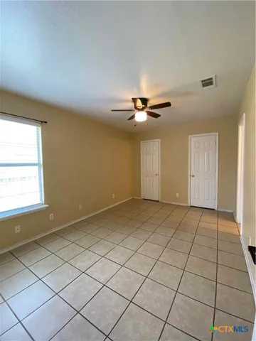 a view of an empty room and window