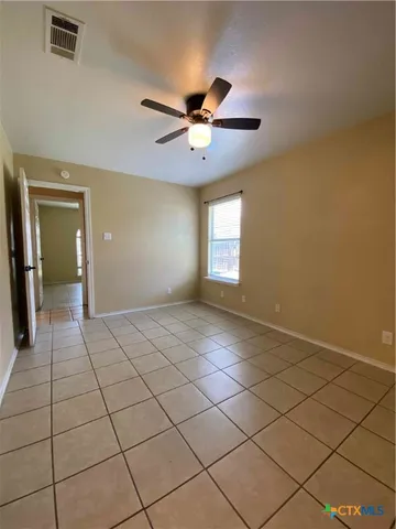 a view of an empty room and window