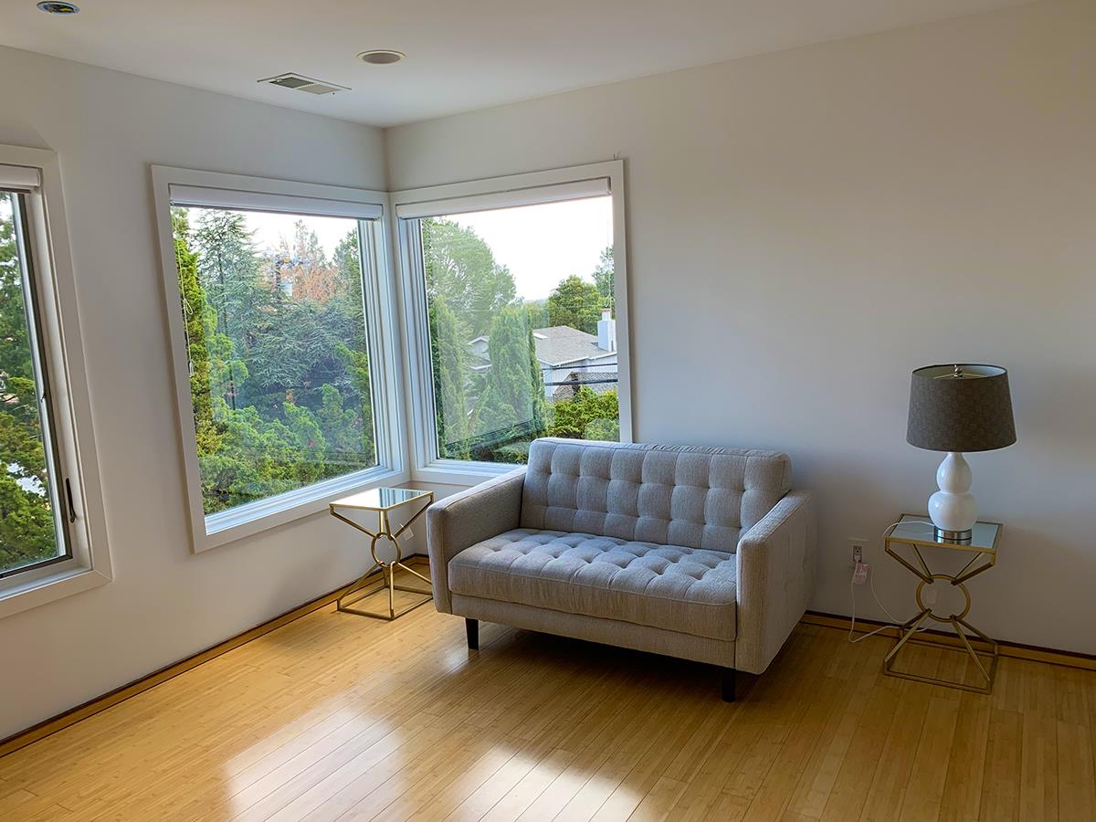 2912 Hillside Drive Burlingame, CA 94010 - Photo 17 of 19 a living room with furniture and a window