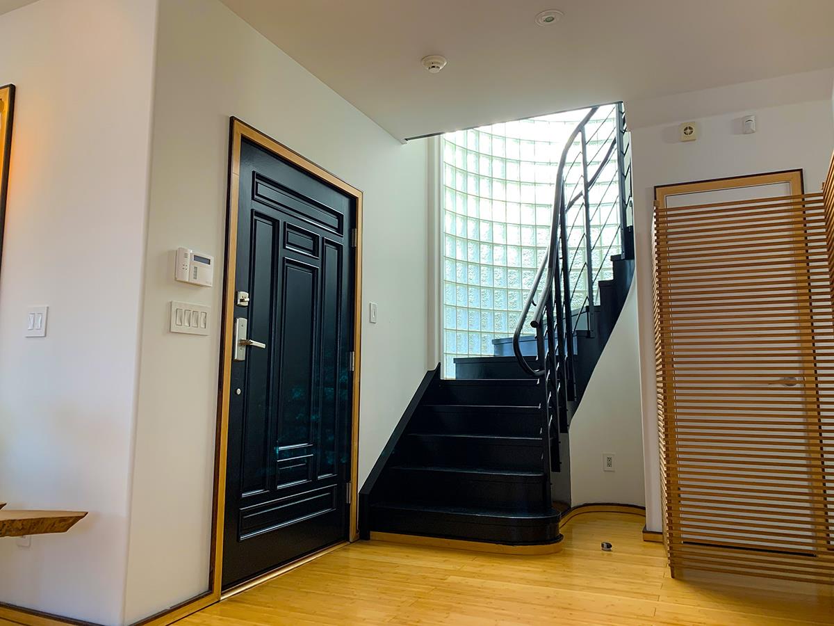 2912 Hillside Drive Burlingame, CA 94010 - Photo 3 of 19 a view of entryway with wooden floor and stairs
