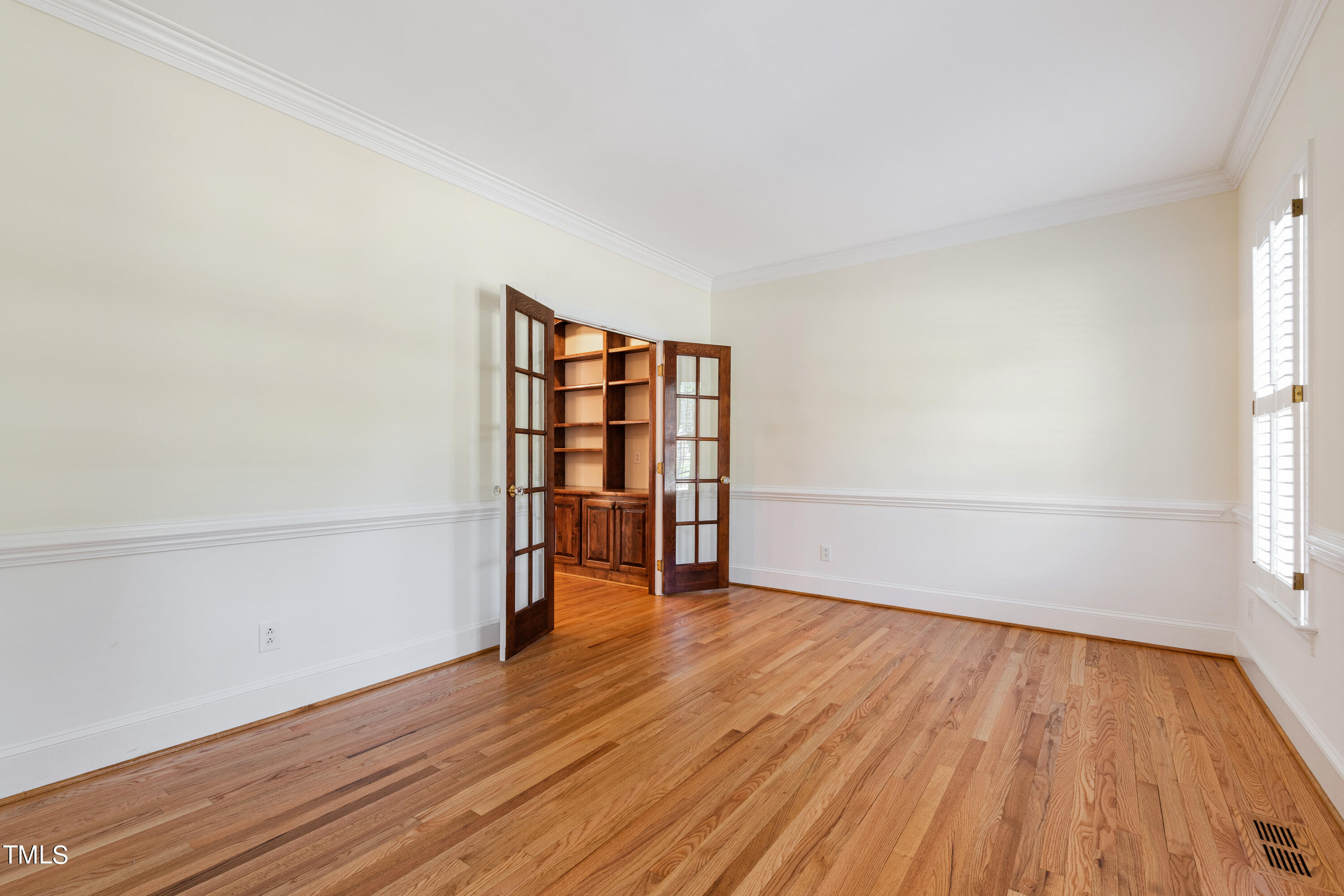 1804 Mcdonald Lane Raleigh, NC 27608 - Photo 15 of 62 an empty room with wooden floor and closet