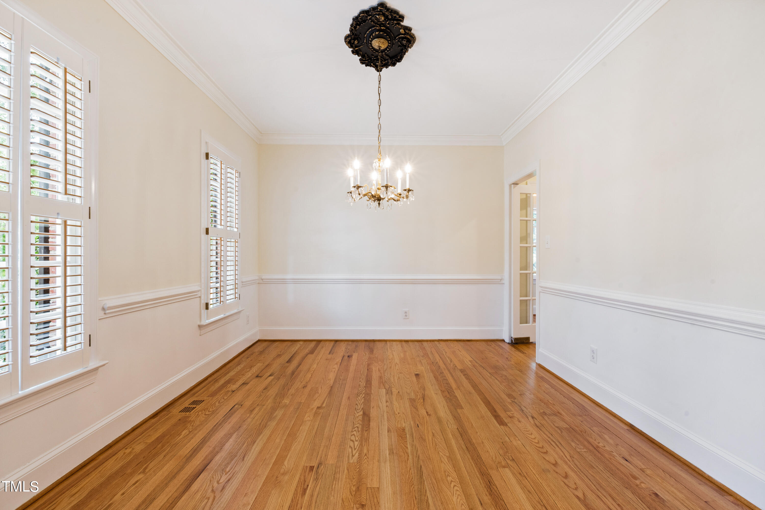 1804 Mcdonald Lane Raleigh, NC 27608 - Photo 16 of 62 a view of a room with wooden floor and a window