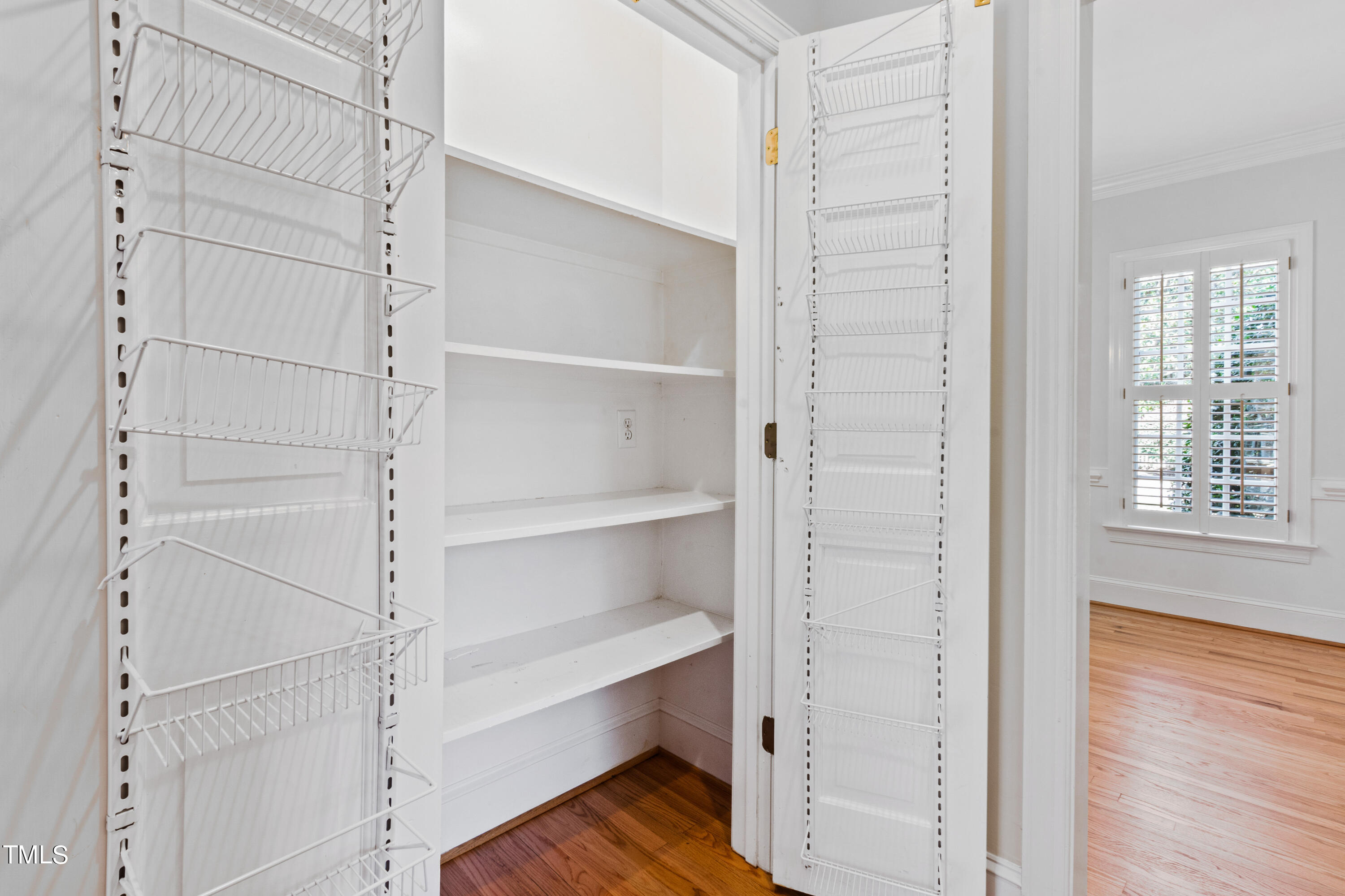 1804 Mcdonald Lane Raleigh, NC 27608 - Photo 23 of 62 a view of walk in closet with empty racks